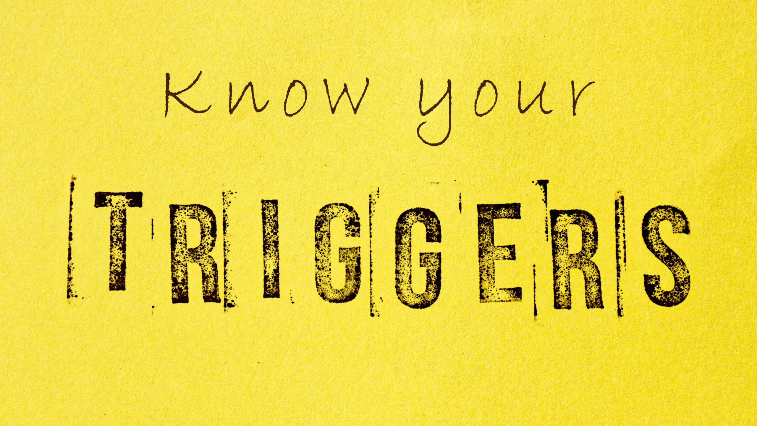 Know your triggers sign message on yellow background. Mental tri